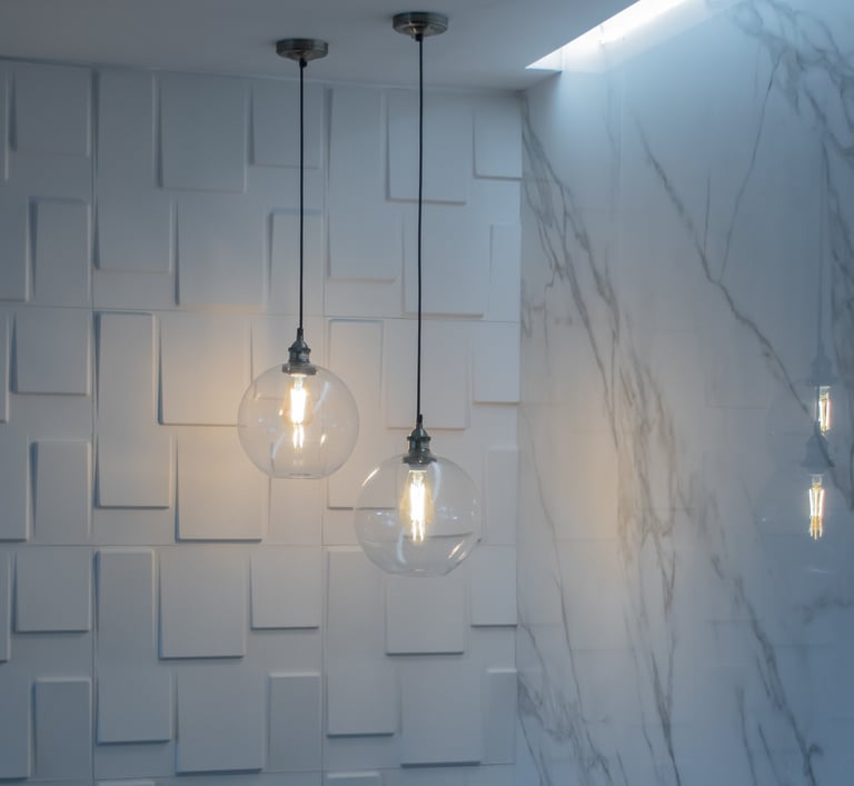 a couple of light bulbs hanging from a ceiling