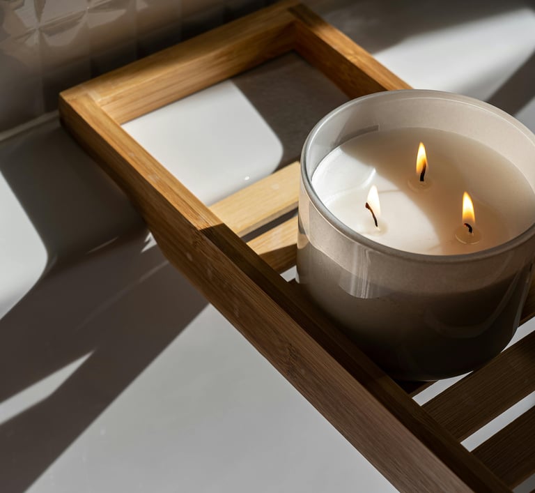 3 wick candle on wooden bath tray
