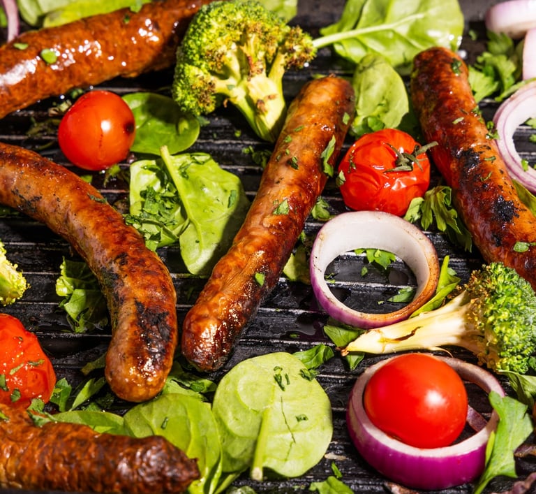 Sustainable plant-based, nutritionally-dense, hypoallergenic protein and fibre sausages with vegetables surrounding