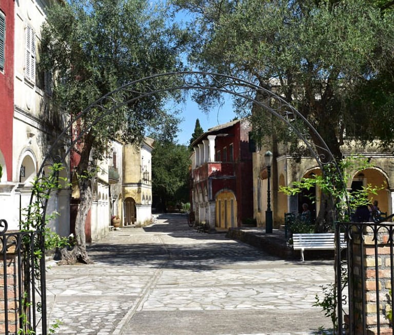 a gated in area with a bench and a bench