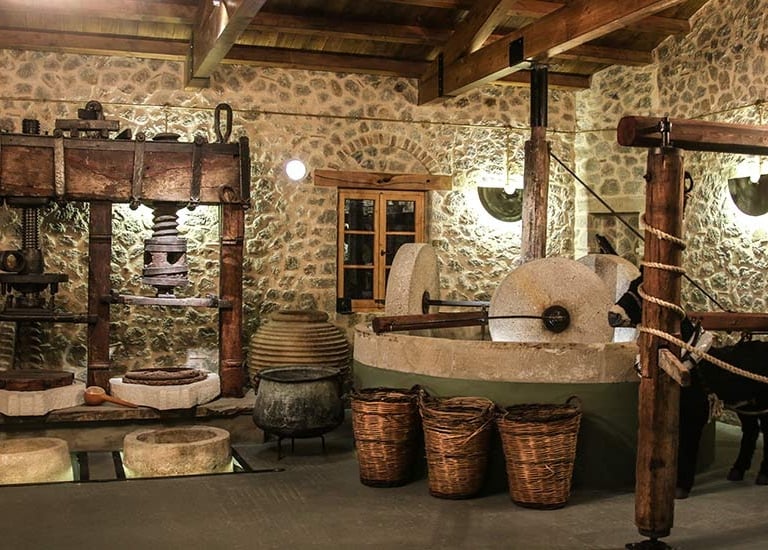 a room with a stone wall and a horse