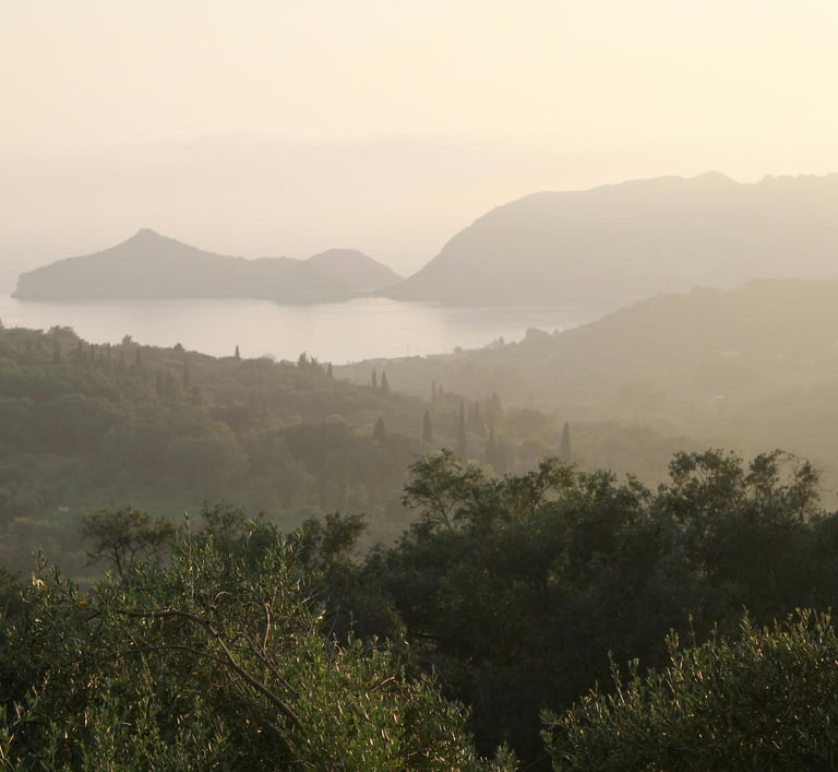 a view of a mountain range with a view of the ocean