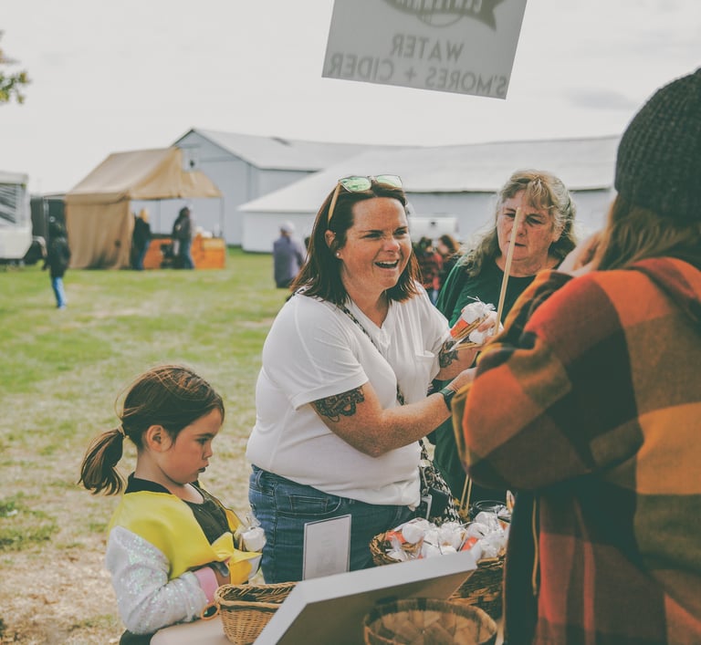group of women enjoying a fall harvest festival
