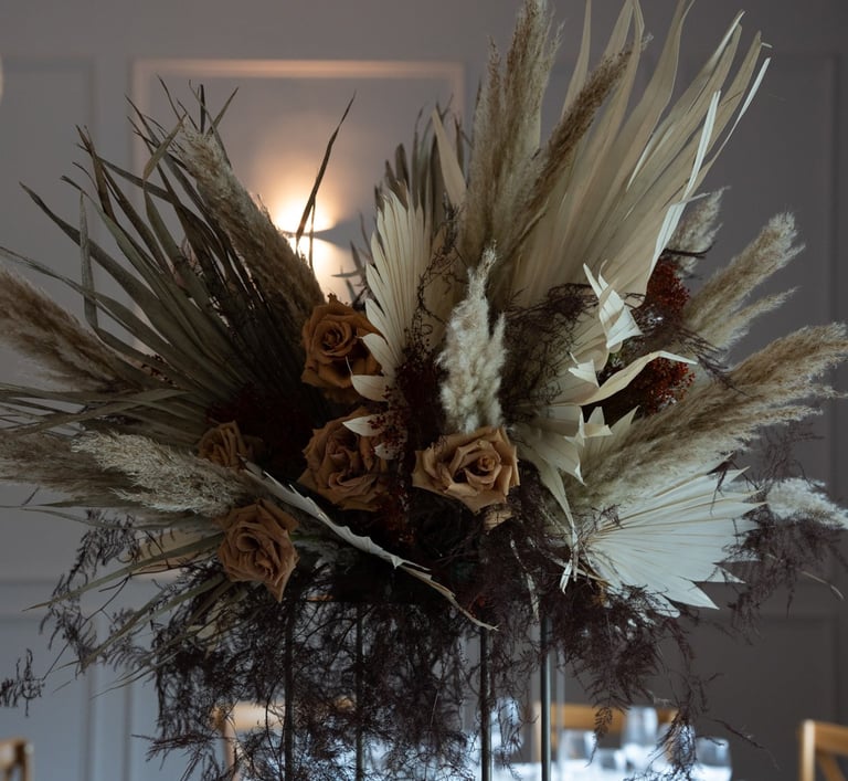 a vase with dried flowers in a vase wedding design