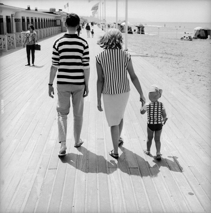 Family on promenade by beach