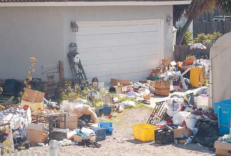 junk on driveway in front of home Richardson, TX