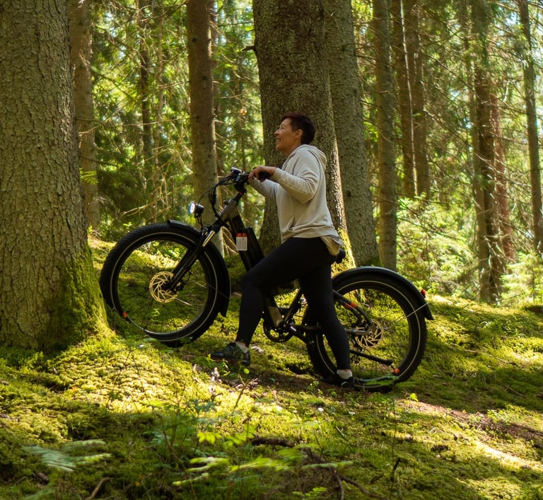 woman going up the hill using electric walk assist function on e-bike