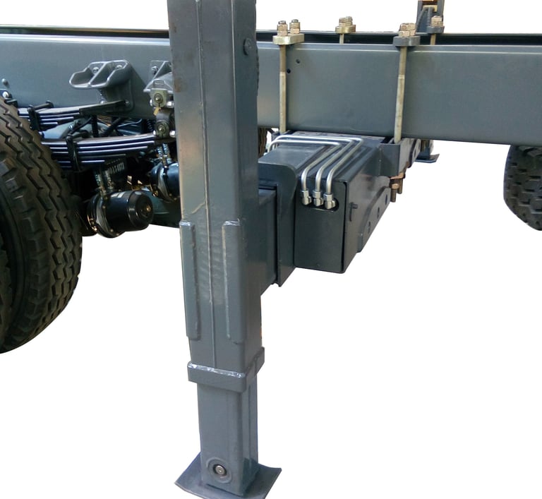 Truck's backside featuring steel plate and rear outriggers for crane support.