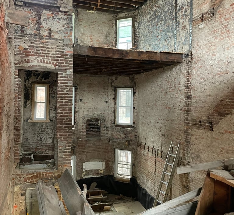 a room with a lot of wood and a ladder