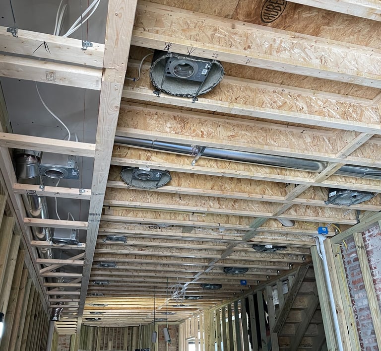 two men working on a construction project in a home