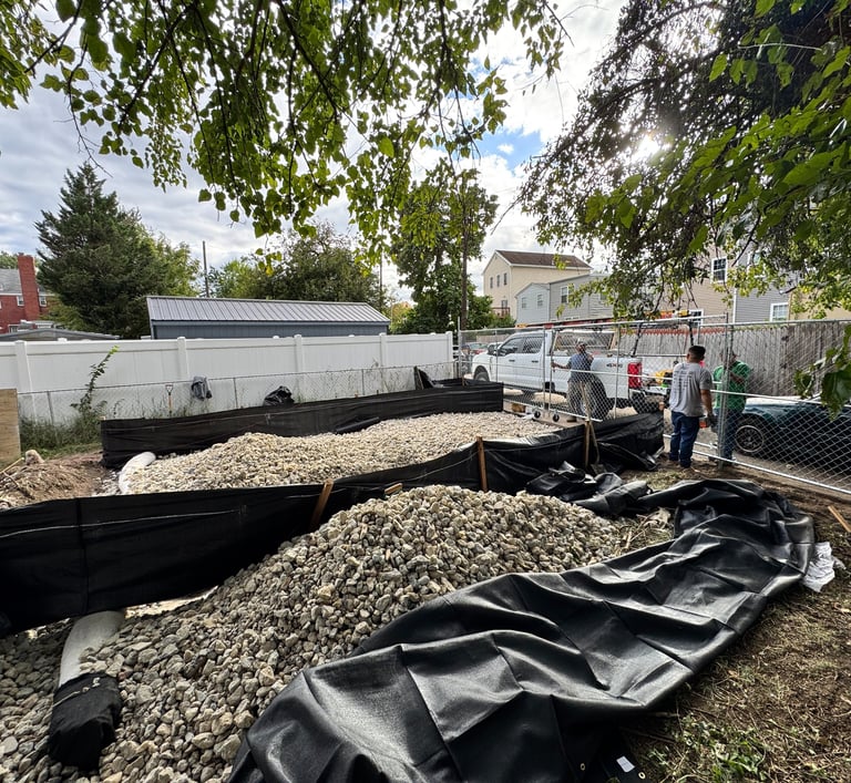 a man standing in front of a pile of gravel