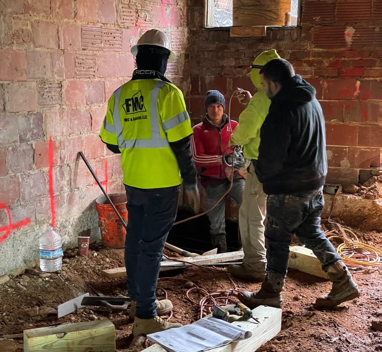 a group of men standing around a building