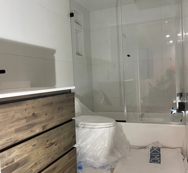 a bathroom with a toilet and a toilet paper roll