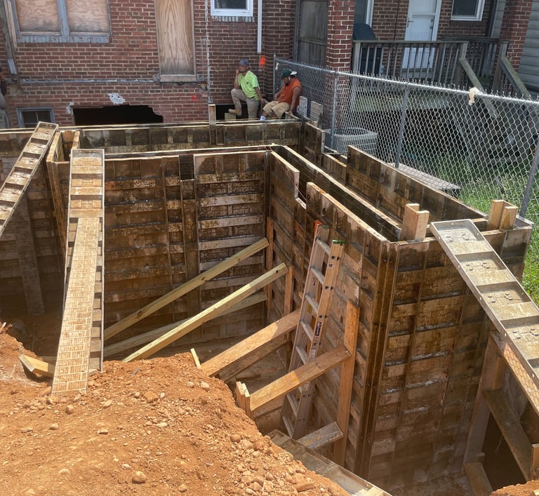 a man is standing in a hole in the ground
