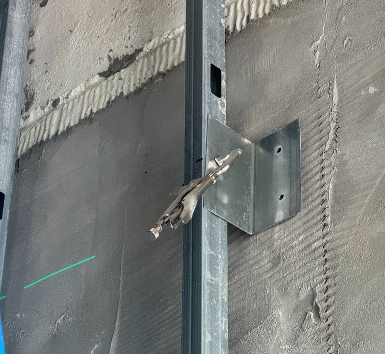 Light-gauge steel stud framing installation in a Washington DC commercial building interior