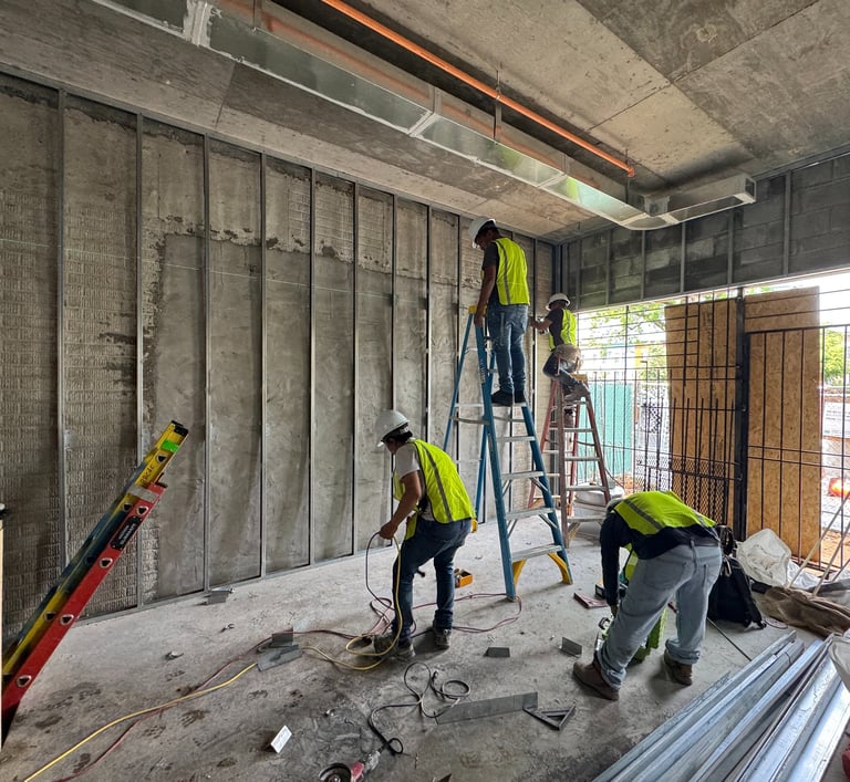 Light-gauge steel stud framing installation in a Washington DC commercial building interior