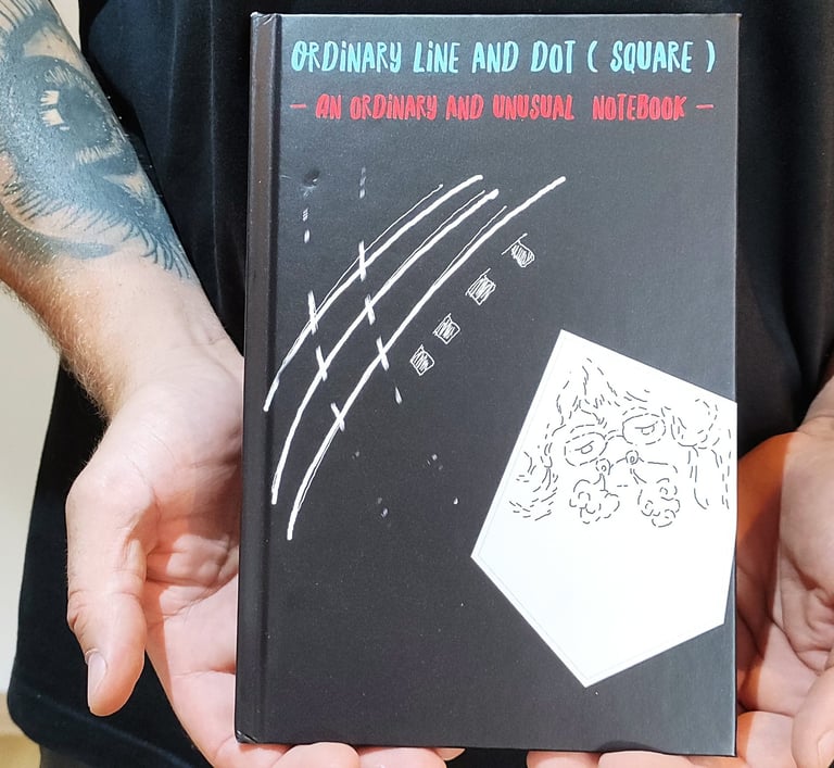 a man holding a book with a book cover