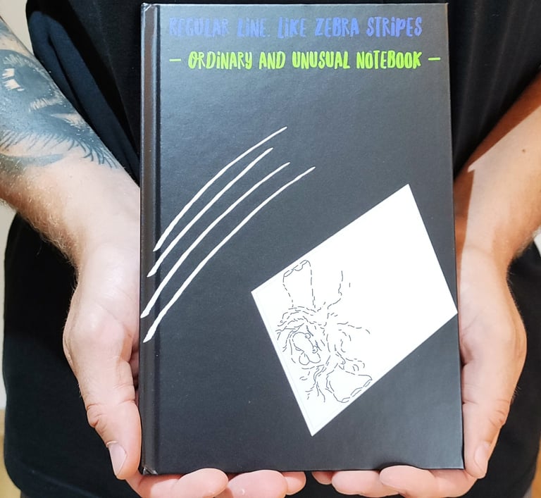 a man holding a book with a book cover