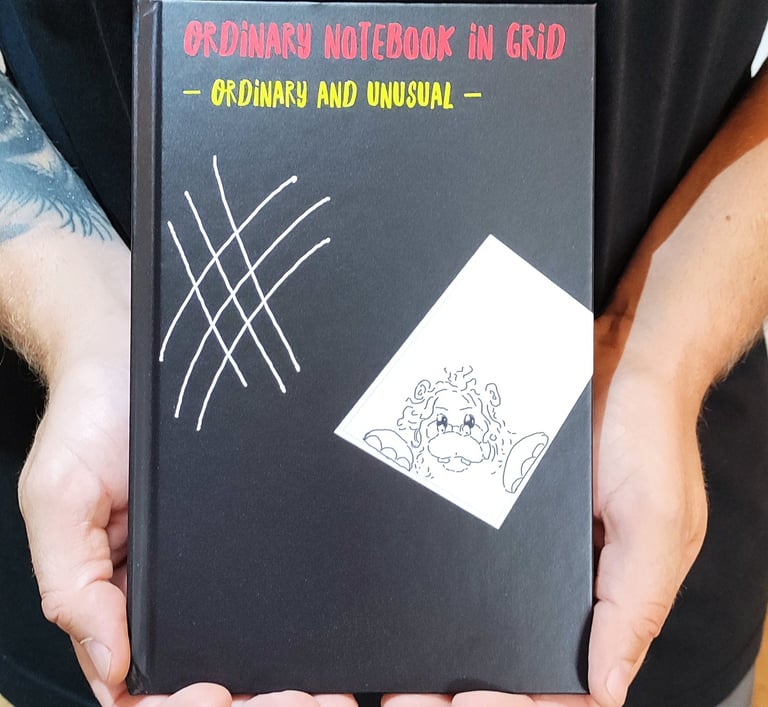 a man holding a book with a book cover