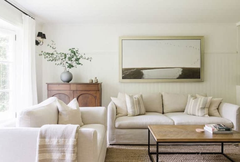 a living room with a couch and a table