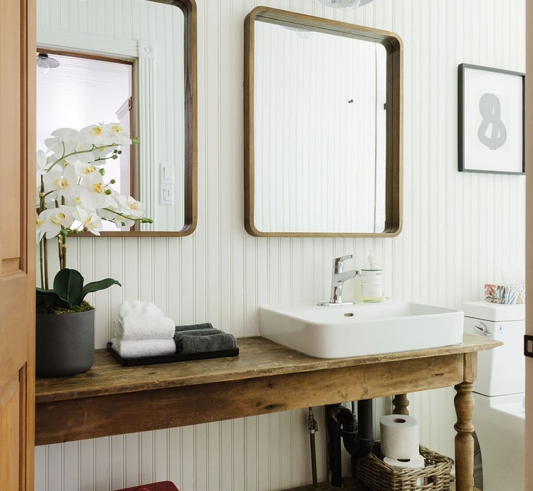 a bathroom with a sink and a vintage wooden vanity
