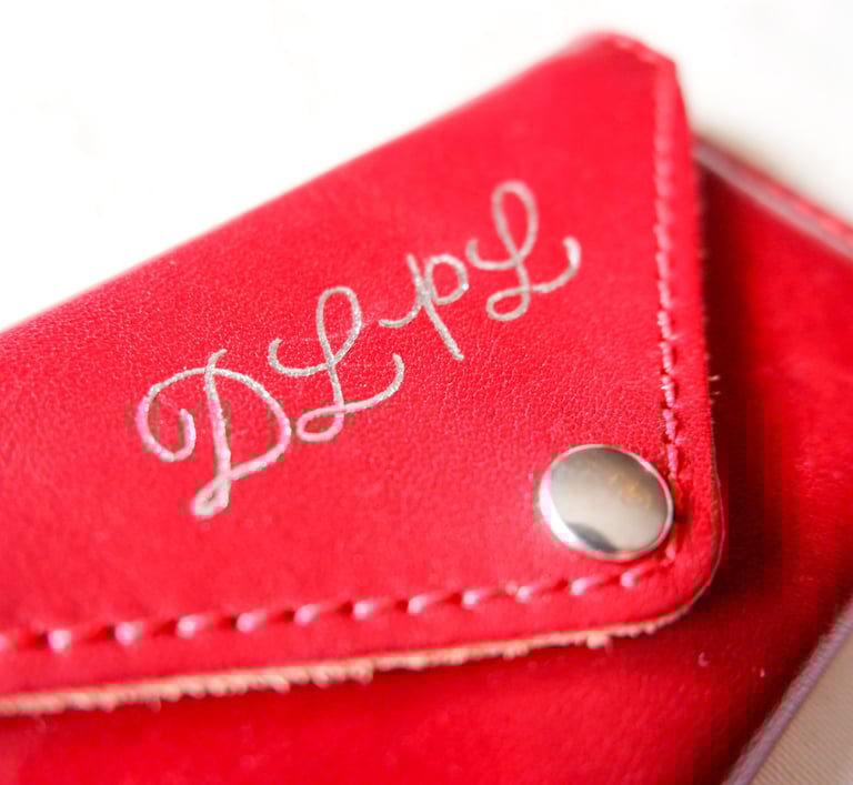 NYC custom hot foiling calligraphy on leather and card accessories by a New York calligrapher