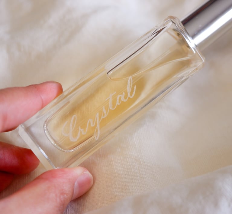 A perfume bottle hand-engraved by NYC engraver Handwritten by Belle.
