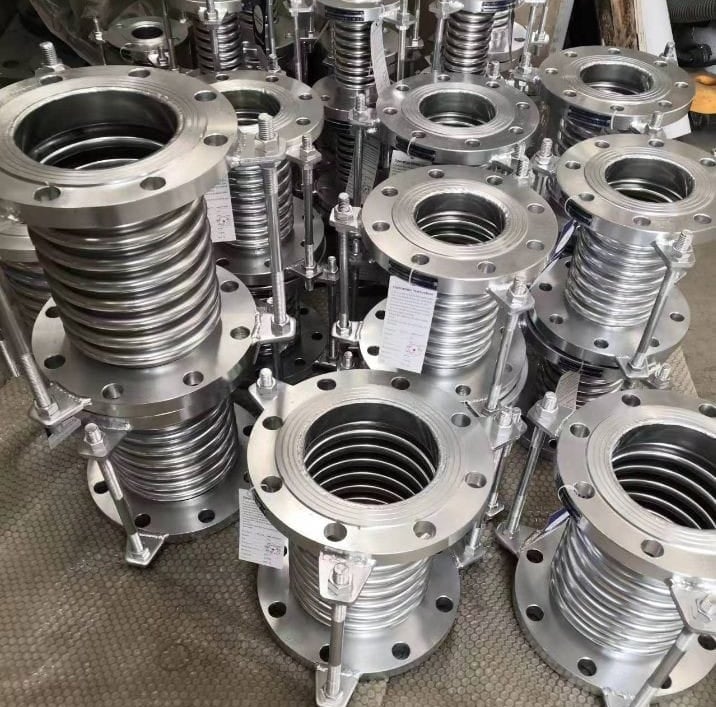 a bunch of metal pipe flanged flanges and a lot of metal