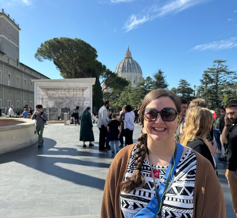 Cassie standing in front of St. Peter's Basilica