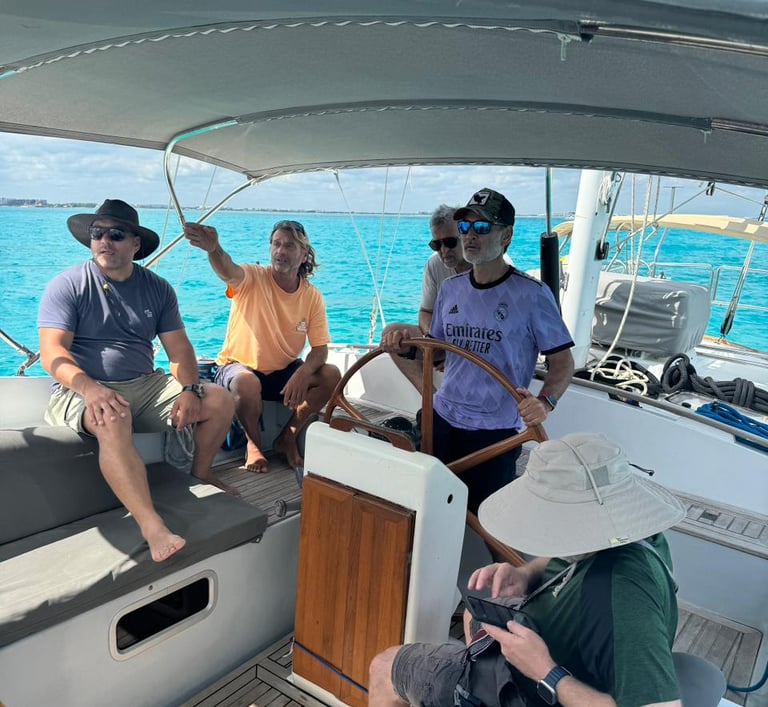 a group of people on a sailing course in Cancun in a sailboat cancun