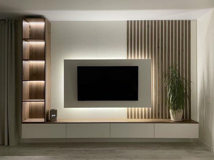 dream furnishings create a purest tv unit with a white light and storage facility thats look wise