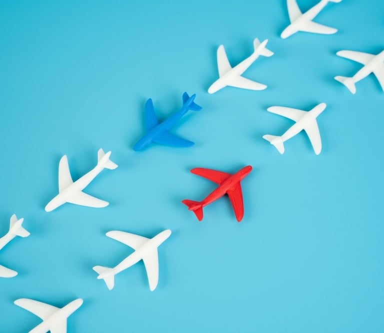 a group of airplanes flying over a blue sky