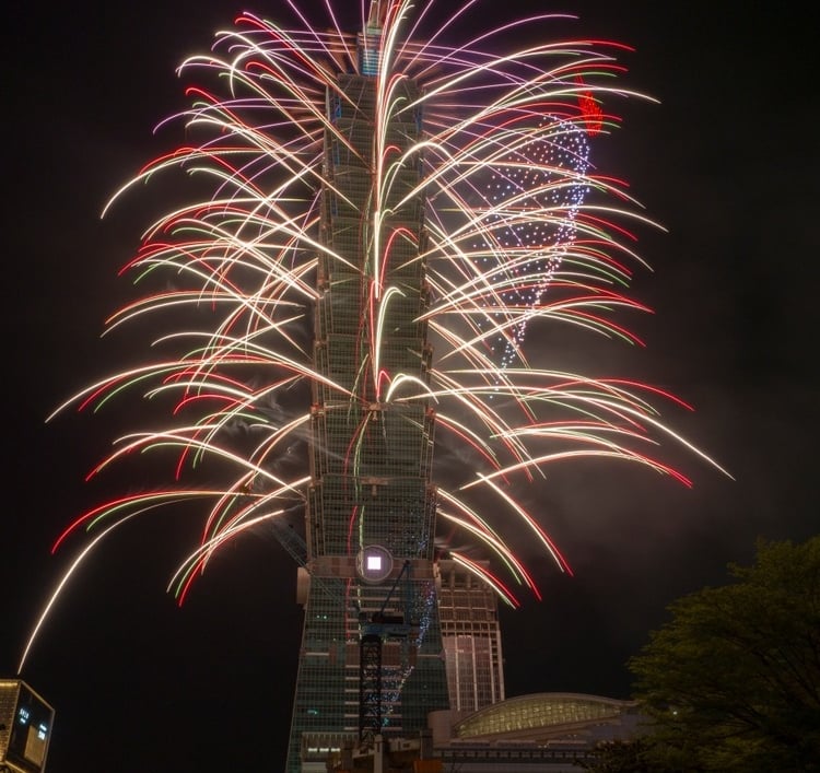 a fireworks is shown in the foreground of a building