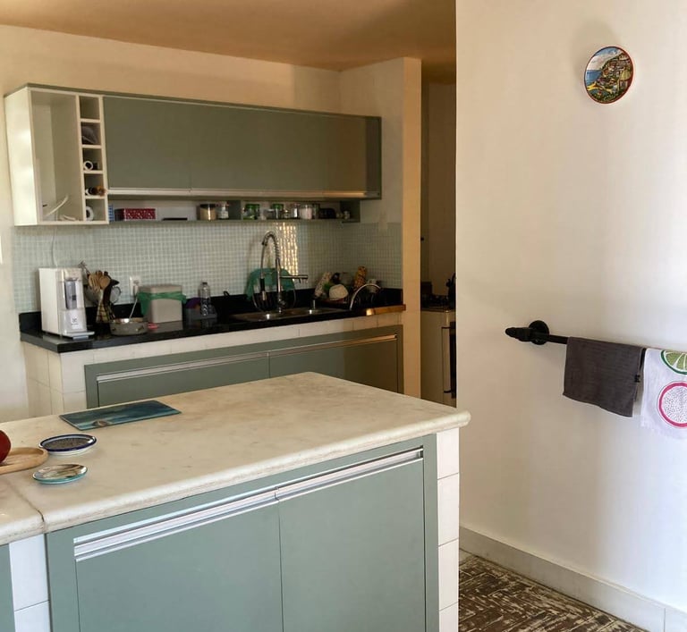 a kitchen with a counter top and a towel rack