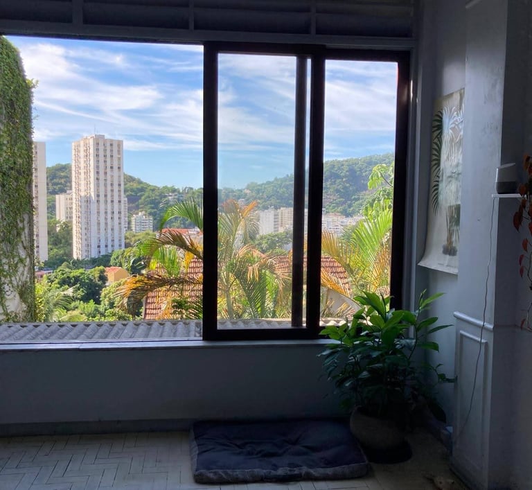 a view of a window with a view of a city