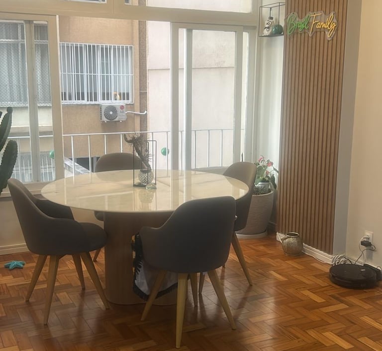a dining room with a table and chairs