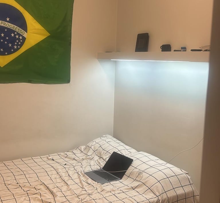 a bed with a laptop computer 