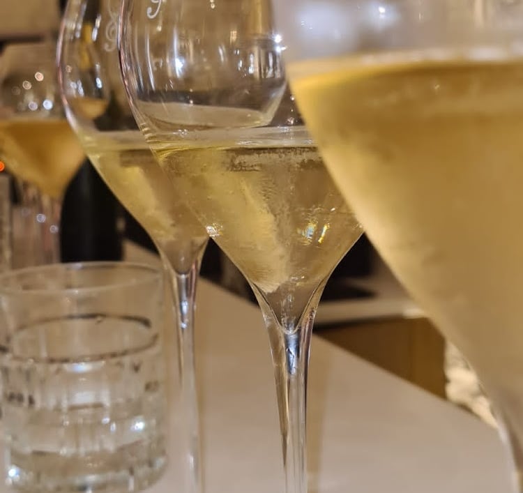Champagne glass on a table in a wine cellar