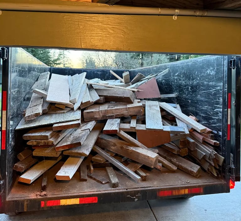 pile of wood in a trailer