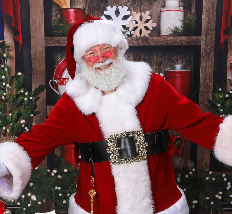 Santa Jay is smiling for the camera.