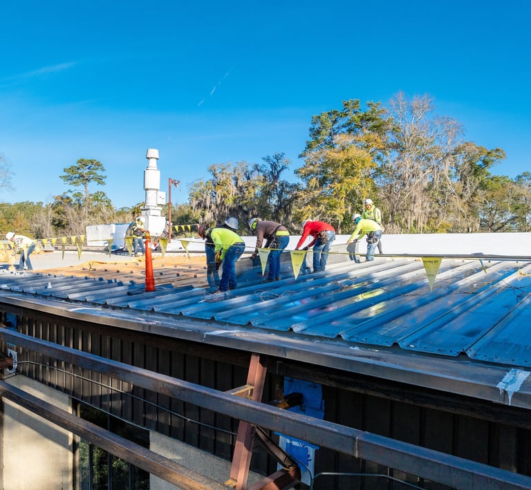 Workers replacing a roof