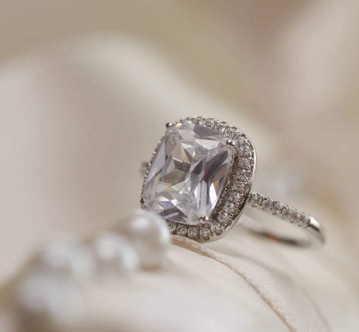 a ring with a CVD Lab-Grown Diamonds ring and a pearl ring