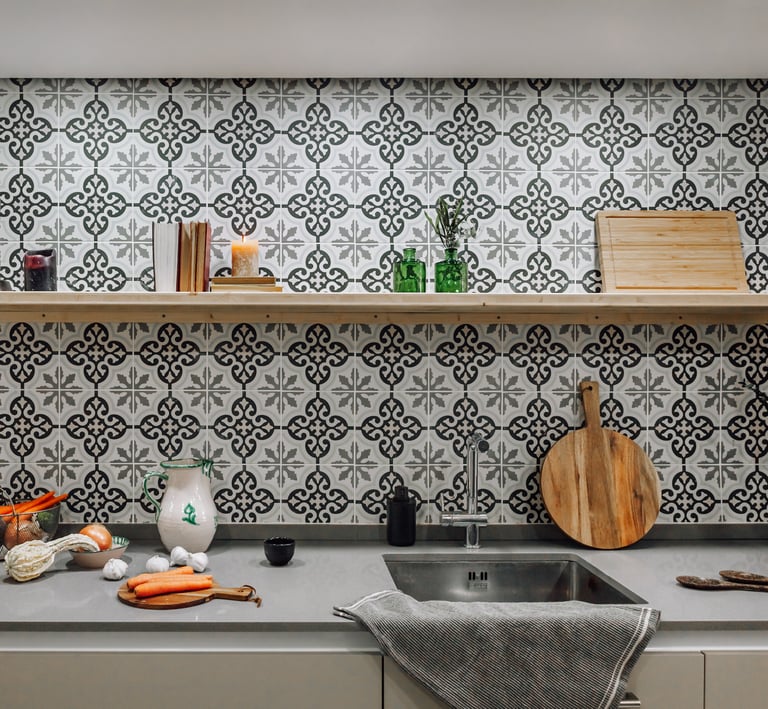Open-plan kitchen with patterned tiles, neutral tones in Rute apartment interior design