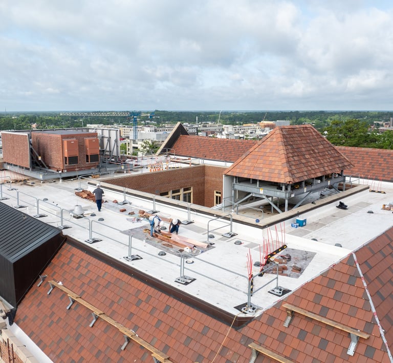 Workers replacing a roof