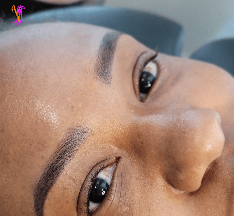 Close-up of beautiful powder or Ombre brow on a client