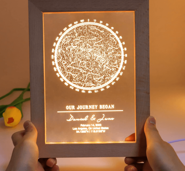 a person holding a personalised engraved star wars light box