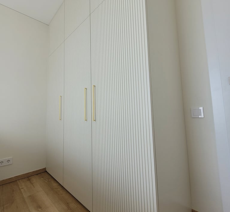 Bespoke wardrobe with Fluted fronts add texture and depth while keeping the look soft and elegant