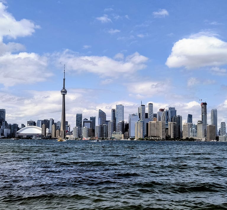 Toronto skyline showing Houses, Condos, Commercial buildings, lake front, legal contracts and land