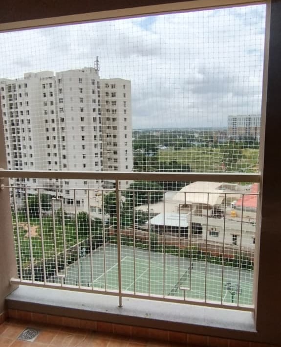 Close-up of a freshly installed balcony safety net in T Nagar, showing the sturdy mesh and secure fi