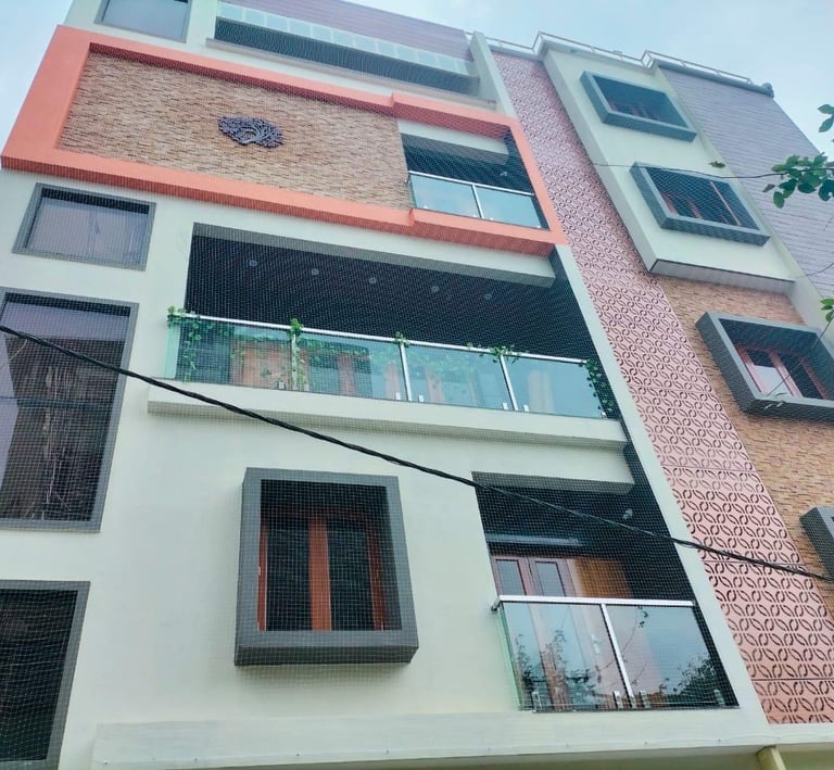 Side view of a balcony net installation highlighting the neat, tight fit against the railing.